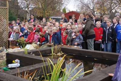 Community event Oak View Landscapes children in front of planting pit