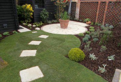 Garden paving stones leading to potted plant