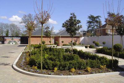 Shrubs planted around a water fountain