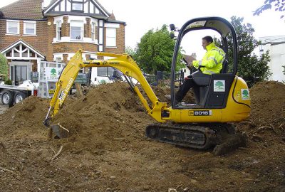 Digger clearing site for construction