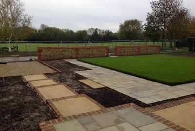 Landscape design with pave paths and lawn