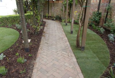 Path going under garden entrances