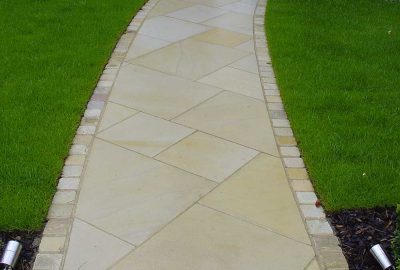 Paved path leading to door