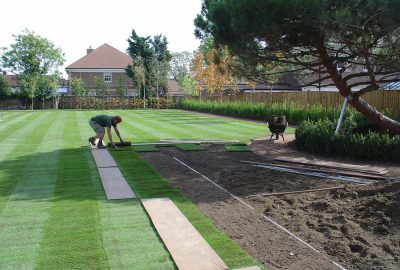 Artificial turf being installed in garden