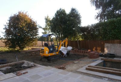 Site clearance with digger removing dirt
